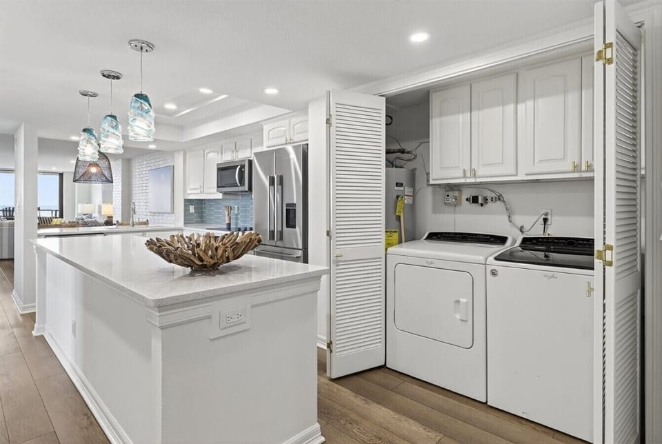 Kitchen with Large Prep Island and In-Unit Washer and Dryer