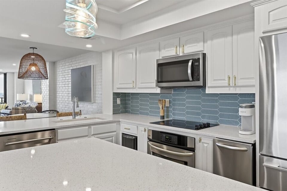 Bright Kitchen with Quartz Counters and Stainless Steel Appliances