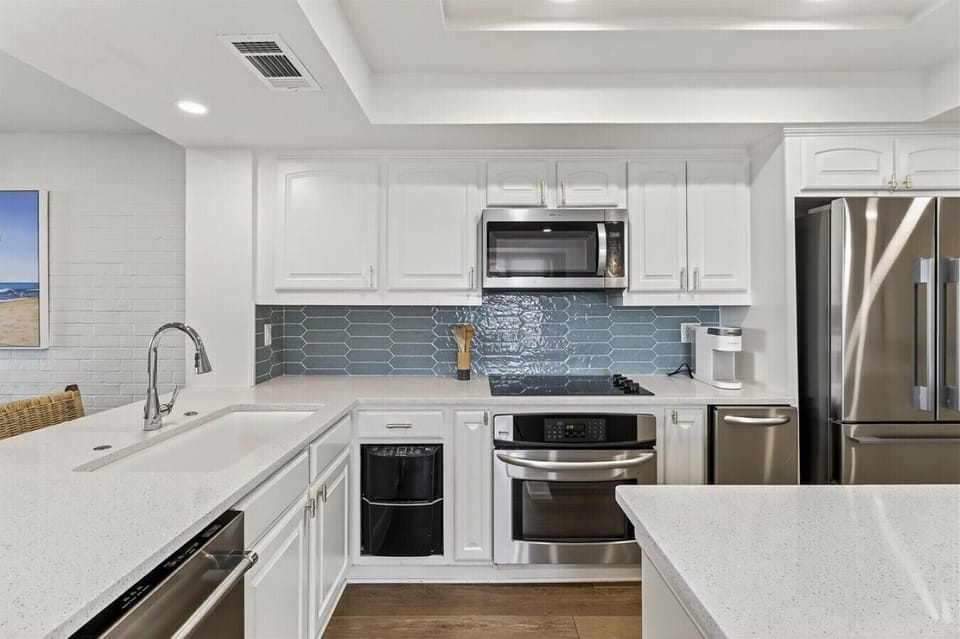 Modern Cooktop and Stainless Steel Appliances in the Kitchen