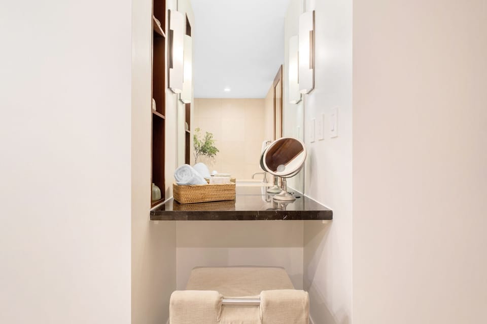 A dedicated prep-and-powder vanity station designed for getting ready in absolute comfort and peace