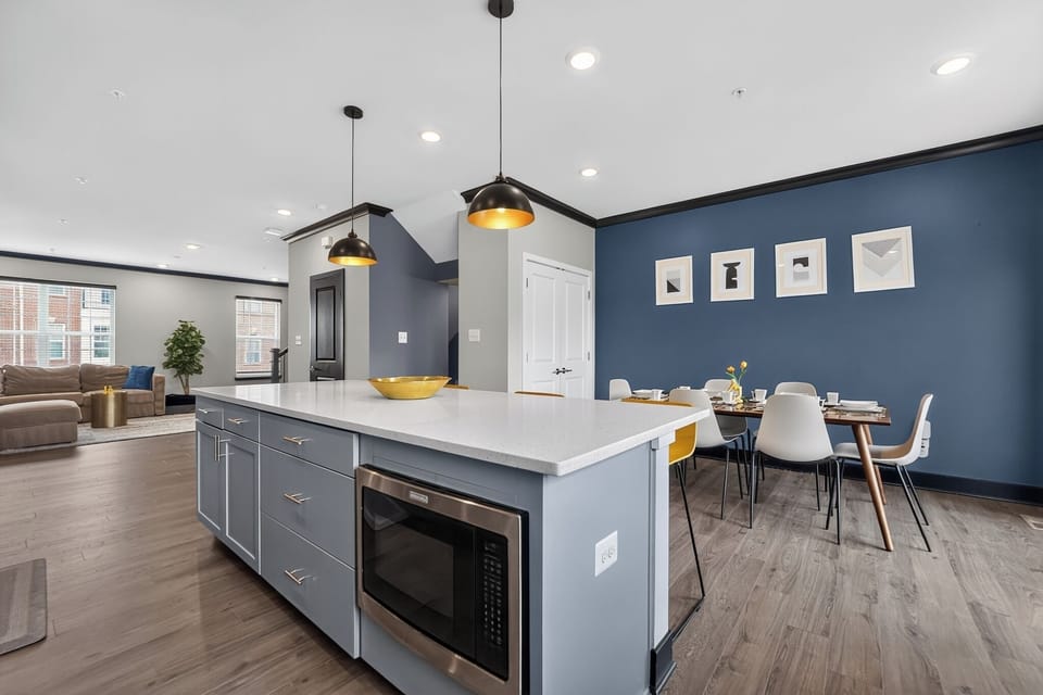 Modern open kitchen with large island and stylish dining space