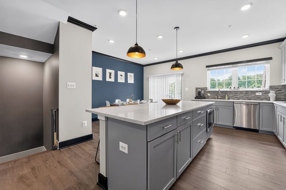 Bright modern kitchen with large island and open dining area