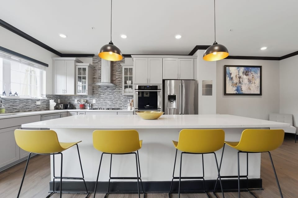 Bright modern kitchen with oversized island seating for four