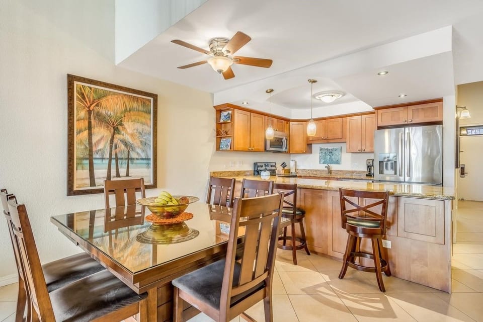 Bright and spacious kitchen with dining area and additional bar seating