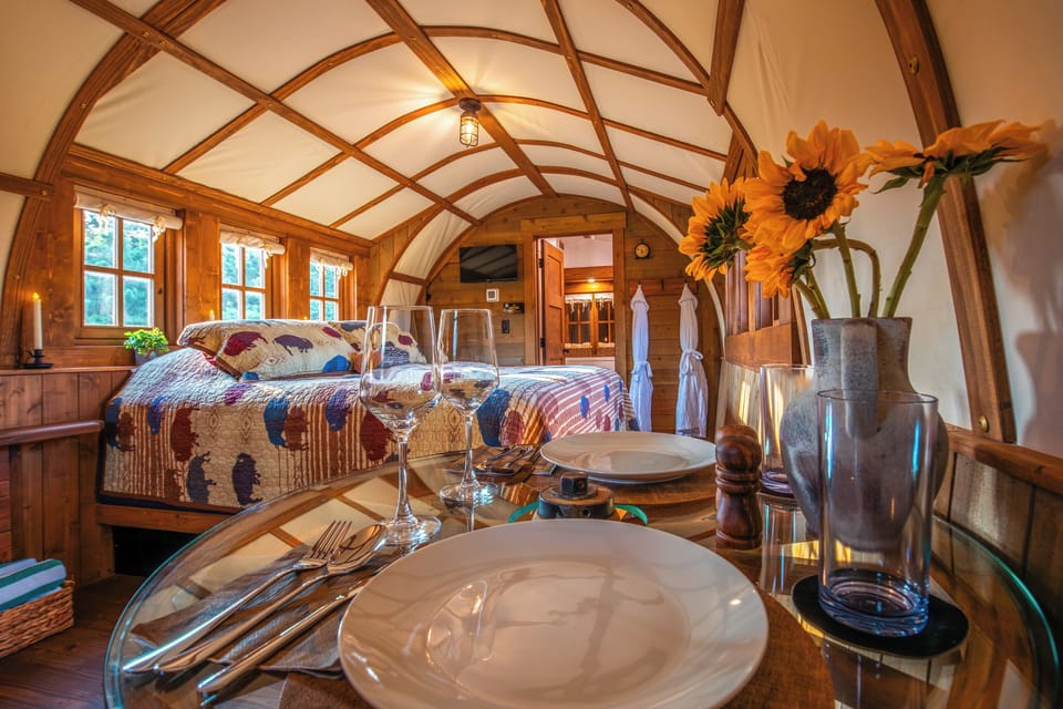 Romantic dining table for two inside the wagon, perfect for coffee, snacks, or a quiet night in.