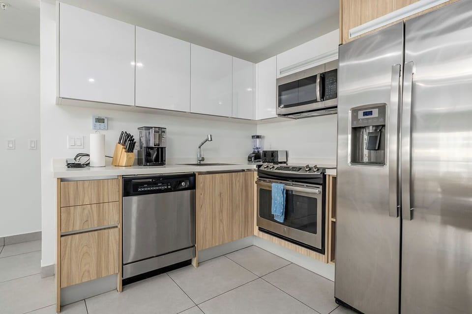 A bright, modern bathroom with a spacious walk-in shower, sleek vanity, and thoughtful touches like quality amenities awaits your morning refresh.