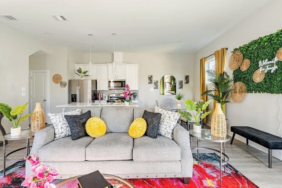 Living Room: Vibrant decor and chic furnishings create an inviting space for relaxation and fun!