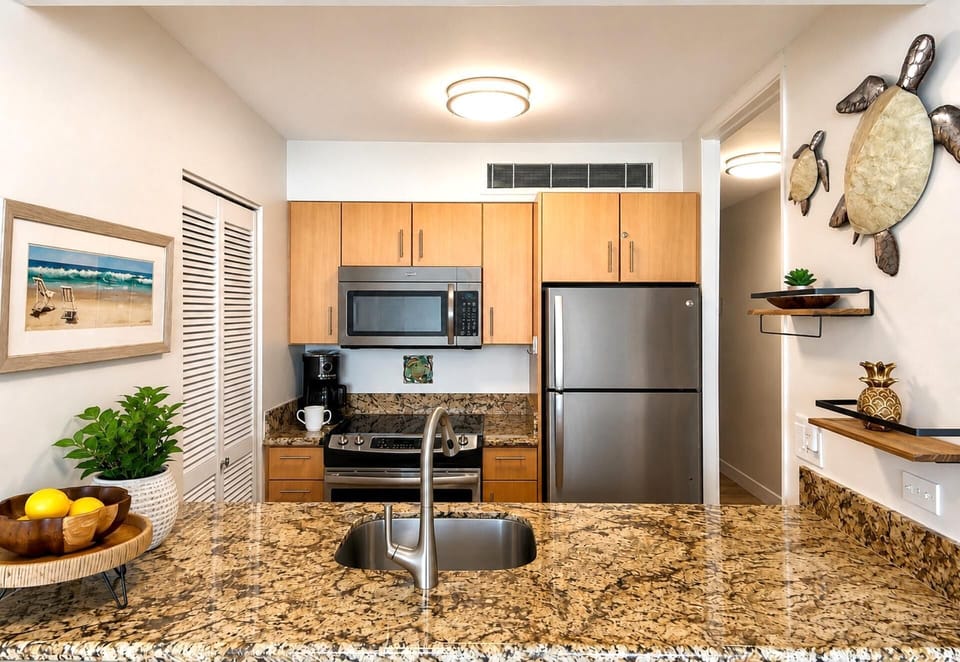 Prepare island inspired meals in the fully equipped kitchen with modern appliances and granite countertops