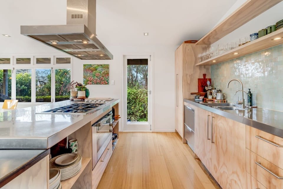 Fully equipped kitchen with generous bench space and a gas cooktop