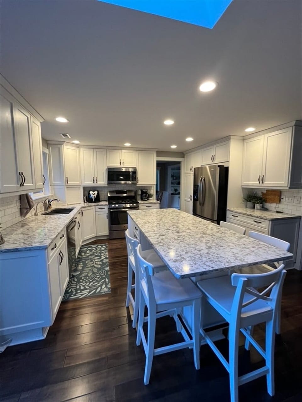 Kitchen island seats five, stainless appliances