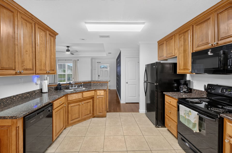 Well-equipped kitchen with ample space for cooking and gathering.