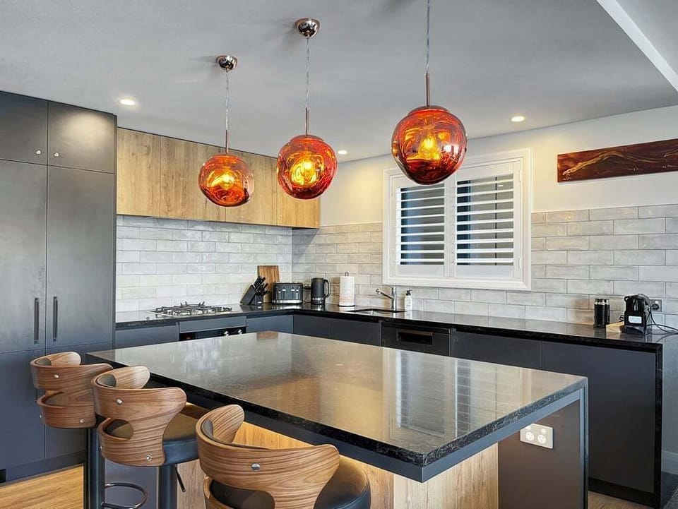 Contemporary kitchen with island and bar seating