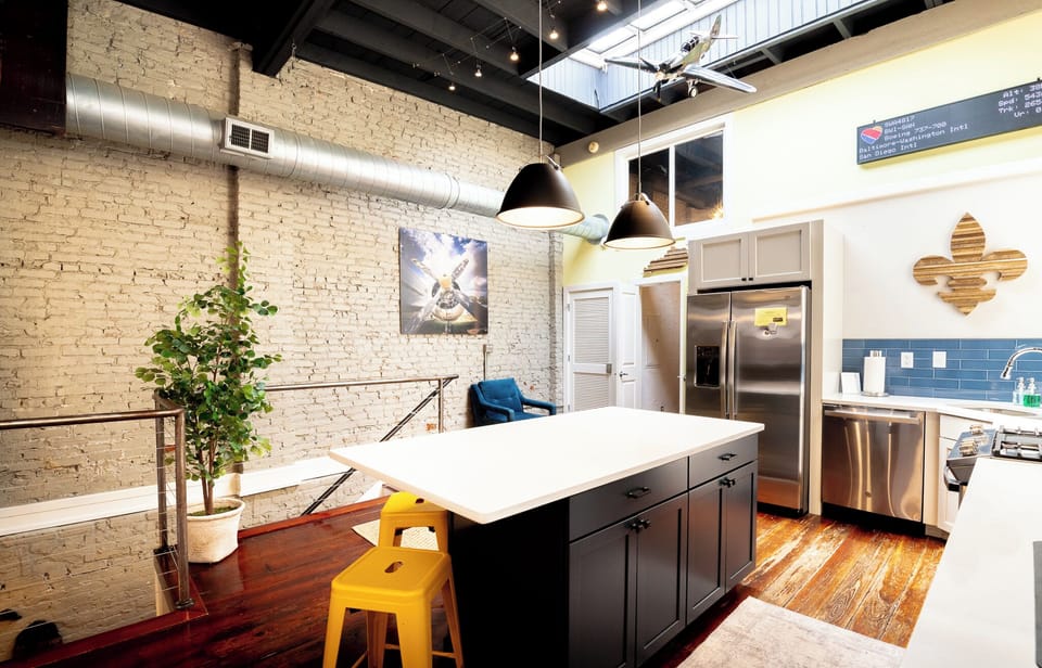 Prepare a feast while bathing in natural light pouring through the huge ceiling skylights. The sleek white countertops provide endless room for your culinary creations.