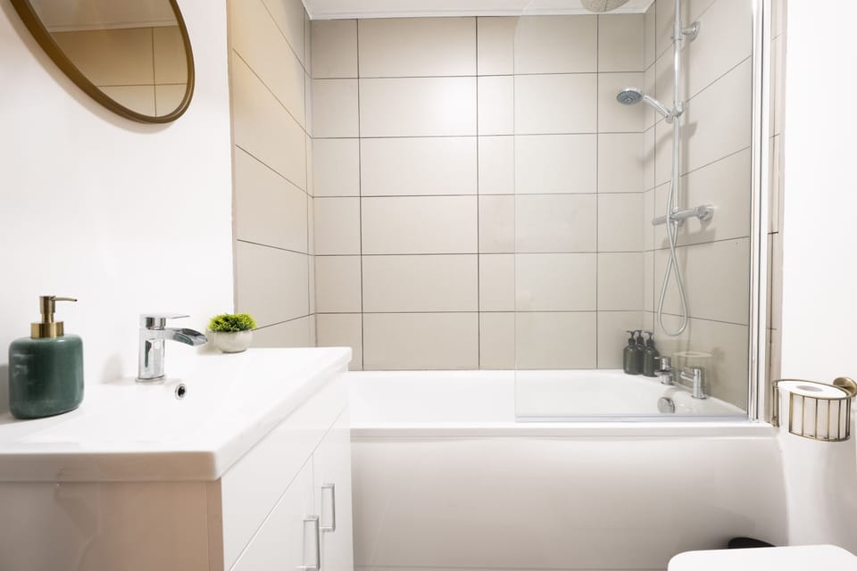Bathroom with vanity sink and bathtub