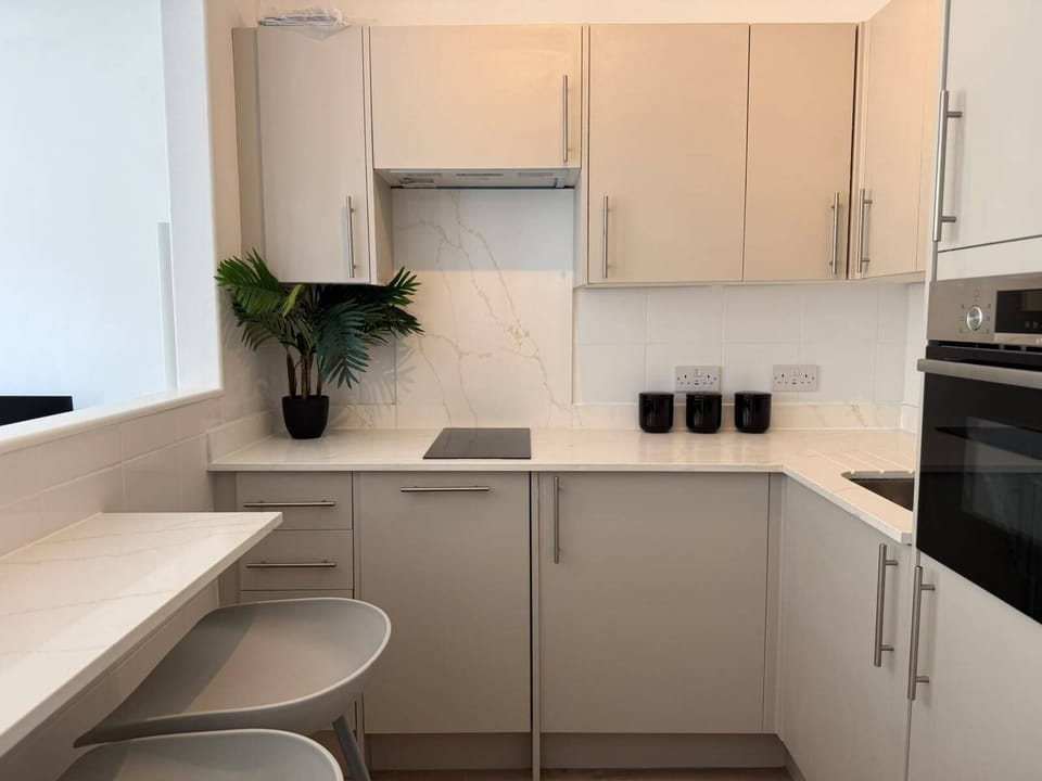 The fully equipped kitchen features a dishwasher, fridge freezer, washer and dryer 