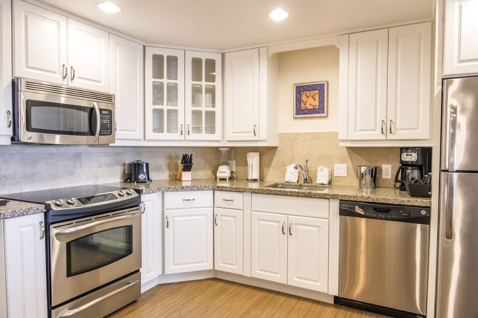 Kitchen • Full Appliances & White Cabinets