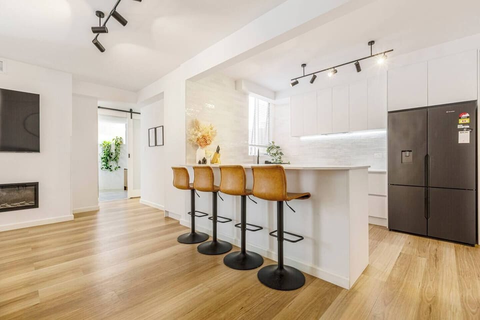 Gather around the island for shared breakfasts, evening drinks, or easy conversation while meals come together nearby.