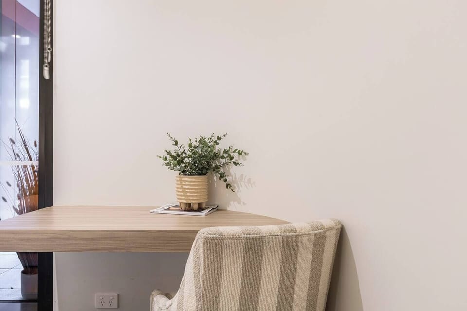 A dedicated workspace within the bedroom provides a comfortable and practical spot for remote work or planning your day.