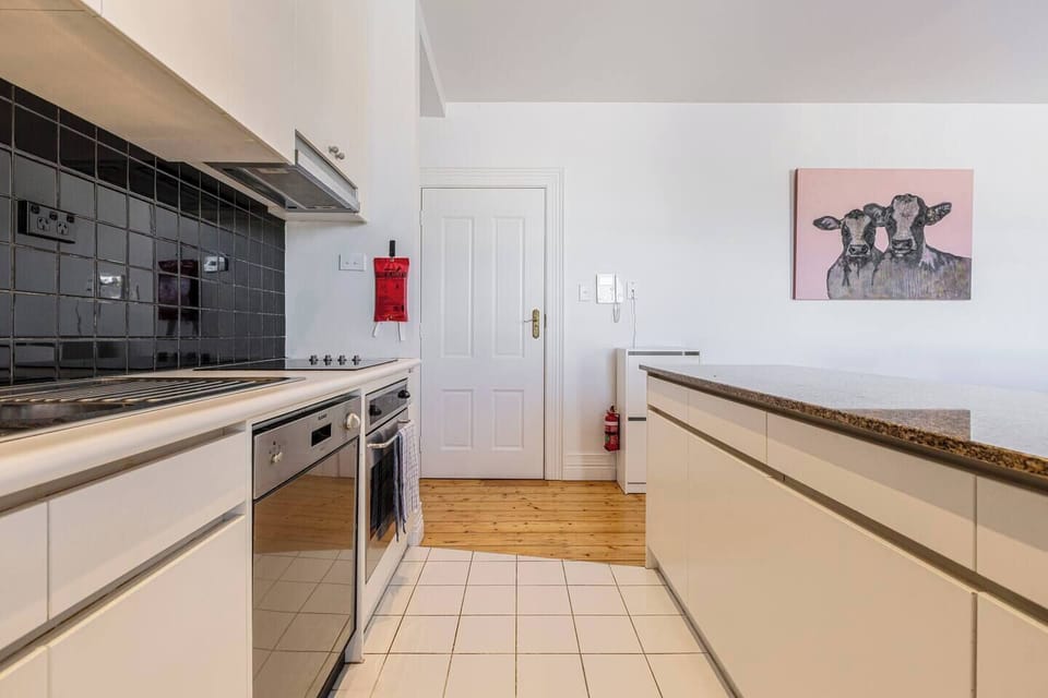 Cook with ease in the fully equipped kitchen, complete with an oven, stovetop, microwave, dishwasher, refrigerator, pour-over coffee setup, and all the essentials you need for a comfortable stay.