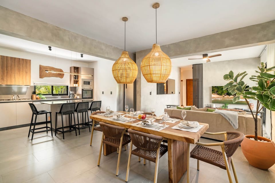 Open concept kitchen, dining, and living room for functionality, comfort and style