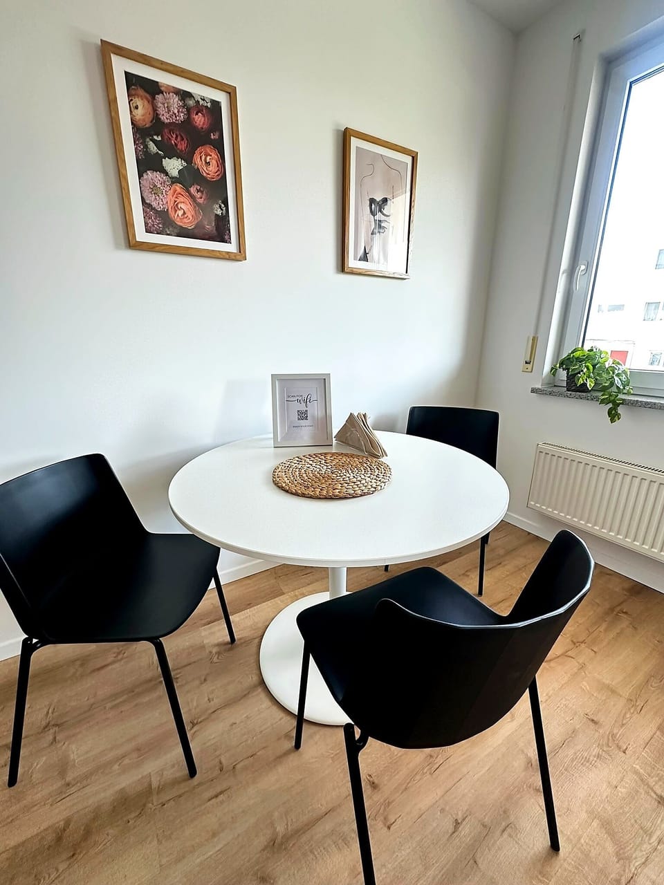 Bright modern dining nook with seating for four and natural light