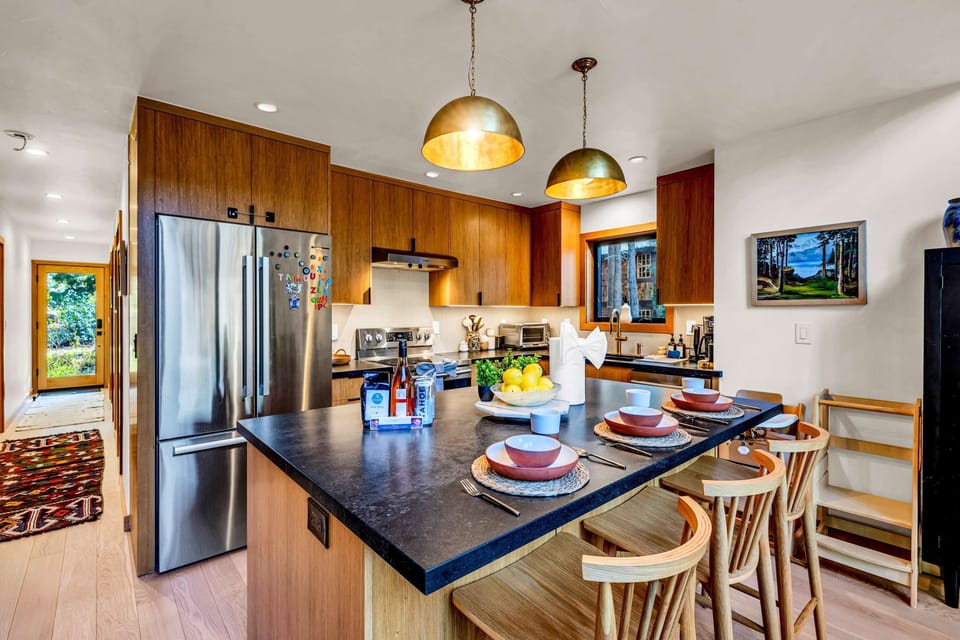Kitchen: Drip coffee maker, range, microwave, refrigerator with ice maker and filtered water dispenser, dishwasher, garbage disposal, toaster oven, air fryer, food processor, kettle, cooking utensils, tableware
