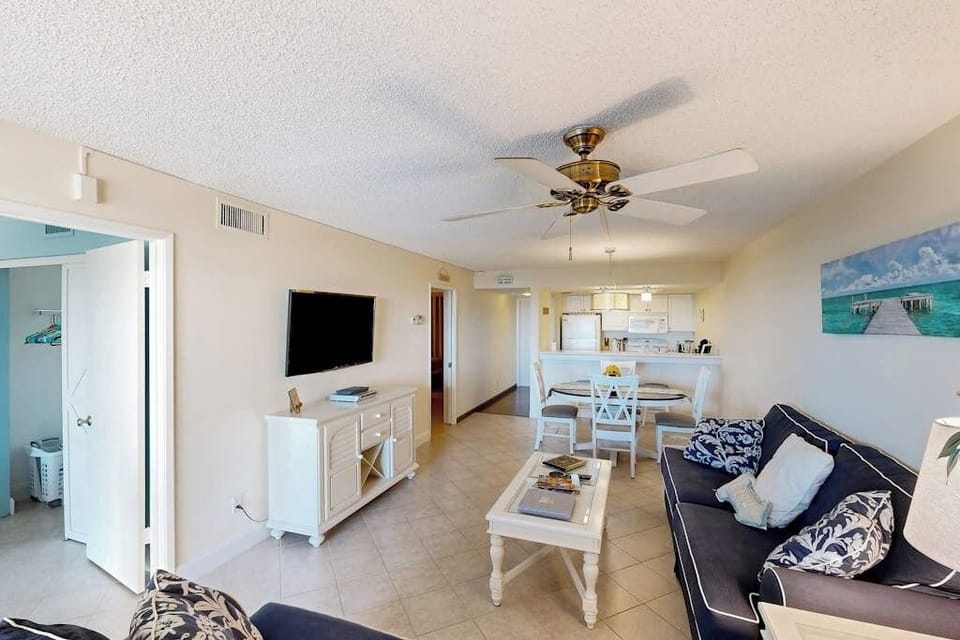 The living room is open with the dining area and kitchen.