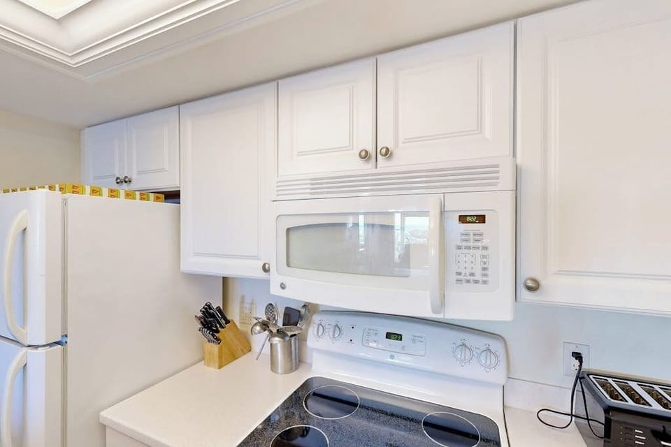 Electric range with stovetop and microwave.