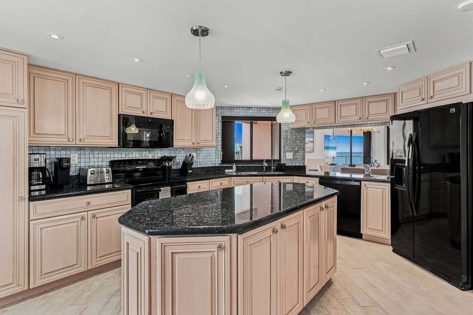 Large, newly updated kitchen and breakfast nook with water views