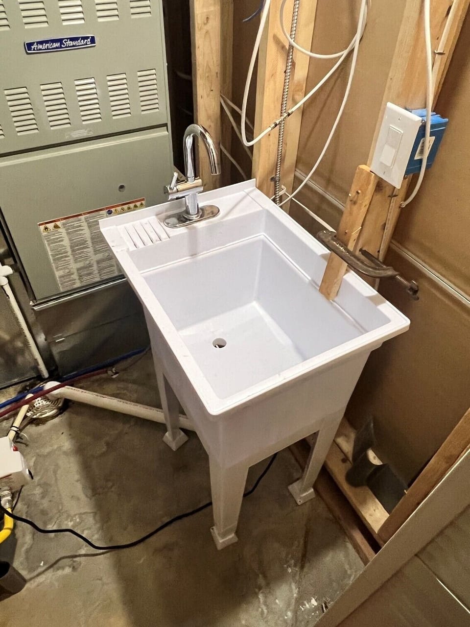 Utility sink just off the dining area. Handy for dishes and hand laundry.