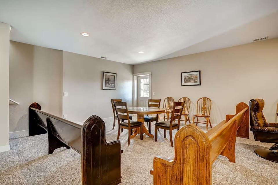 Dining table separated from sleeping and social areas. Plenty of extra seating.