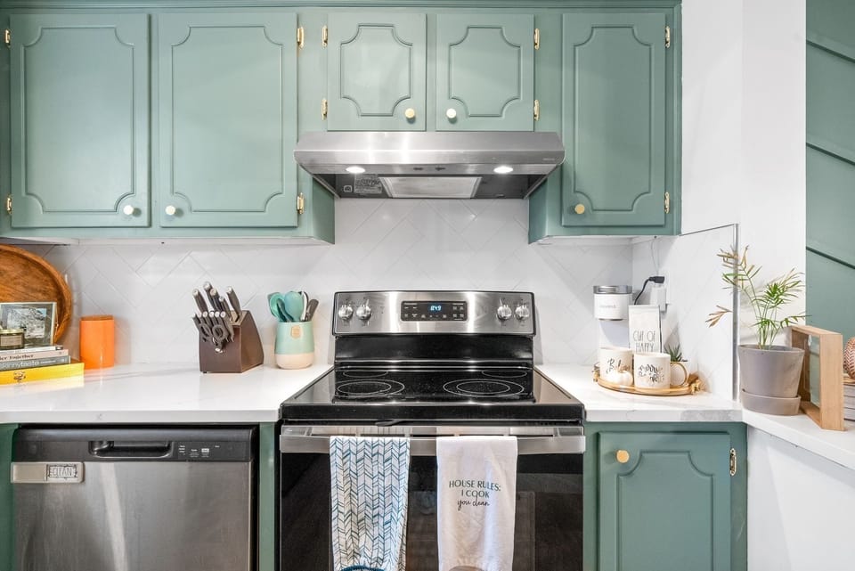 Stainless steel appliances include an oven, stove, & dishwasher