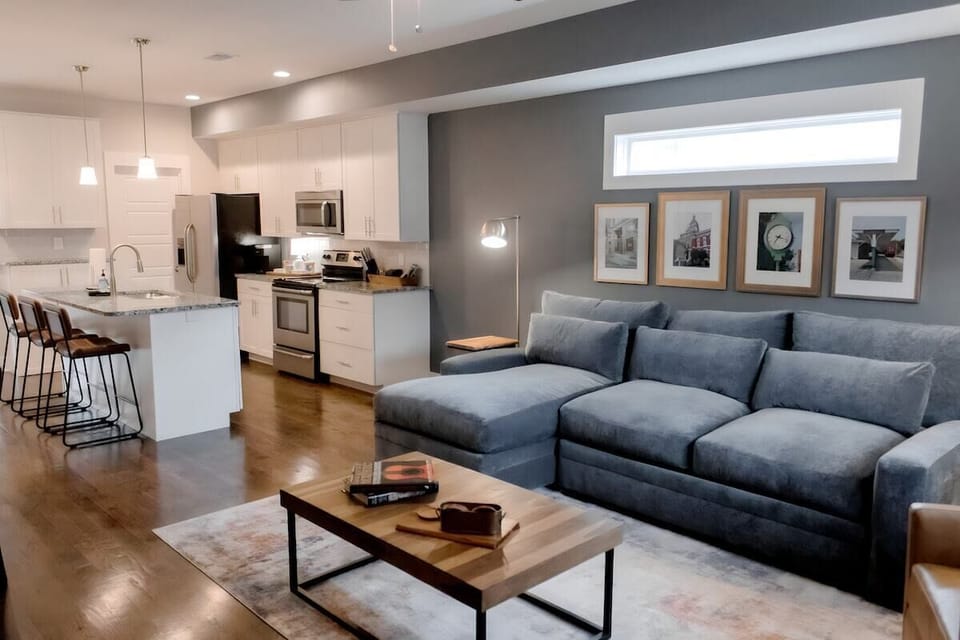 Downstairs open concept spacious well stocked kitchen, comfy living room, dining room and 1/2 bath.