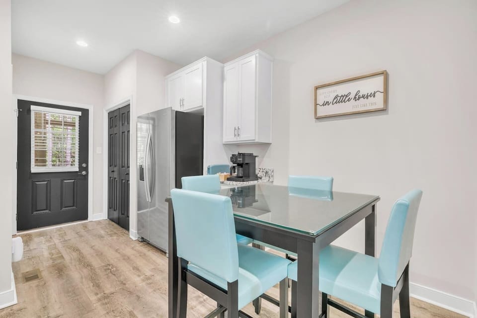 Dining area with comfortable seating for four.
