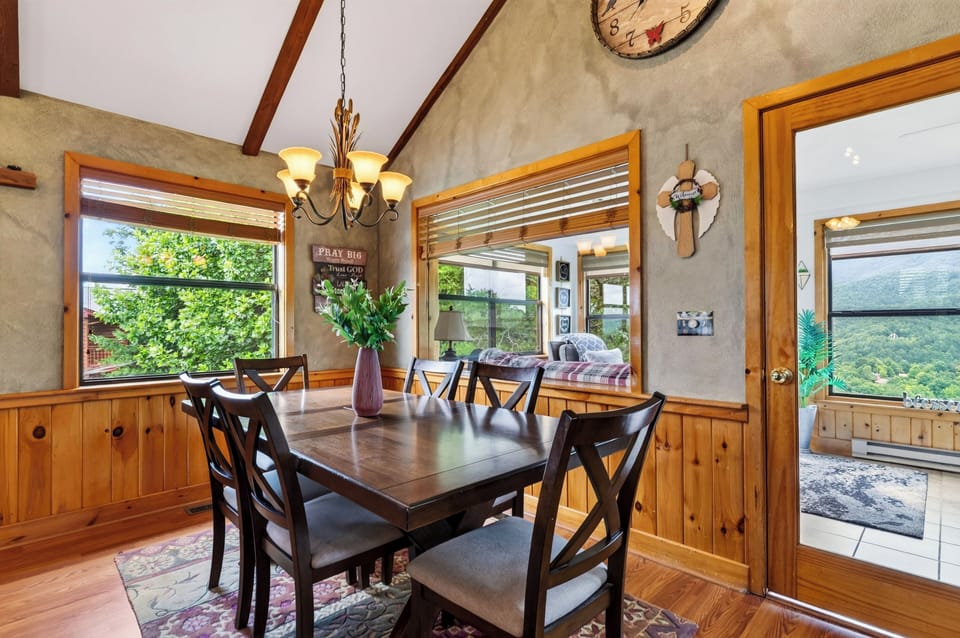 Alternate angle of the dining space with surrounding warm wood interior.