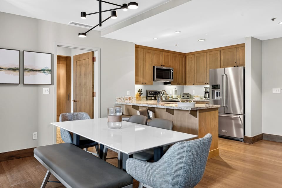 Gather around the dining table with the fully equipped kitchen and breakfast bar just steps away.