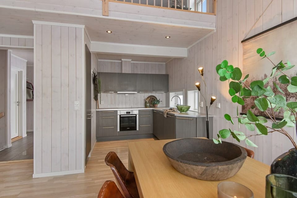 Fully equipped kitchen with cooking essentials and comfortable dining space with seating for the whole family.