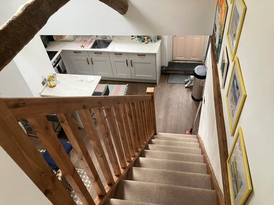 View to the kitchen and living room from the bedroom