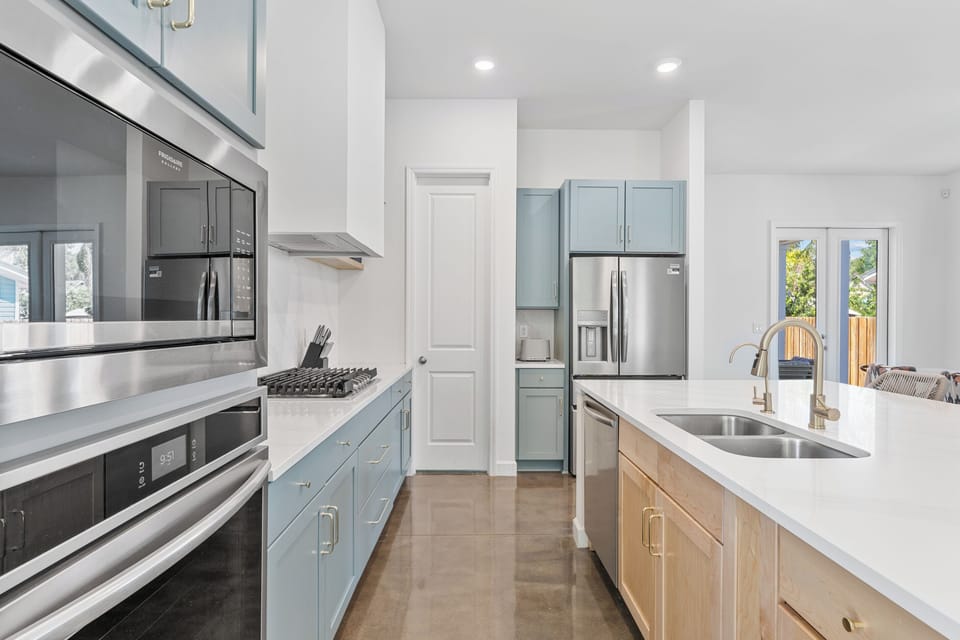 Everything a family cook could want: gas burners, double ovens, a walk-in pantry and counter space to spare. Line the kids up for assembly-line sandwiches, then slip out back to eat while the light still lasts.