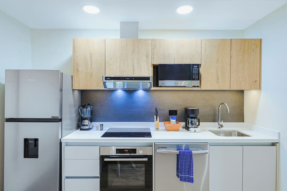 Your fully equipped kitchen awaits, with stainless steel appliances, sleek countertops, and everything you need to prepare meals at your own pace.