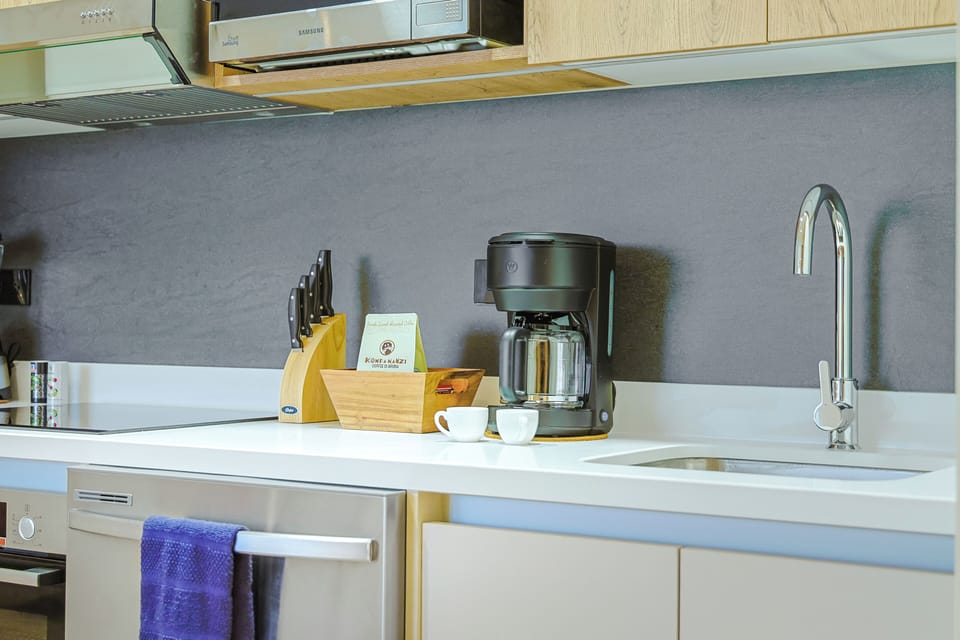 Your fully-equipped kitchen makes meal prep effortless, with modern appliances and a coffee maker ready to brew your morning cup before exploring the area.