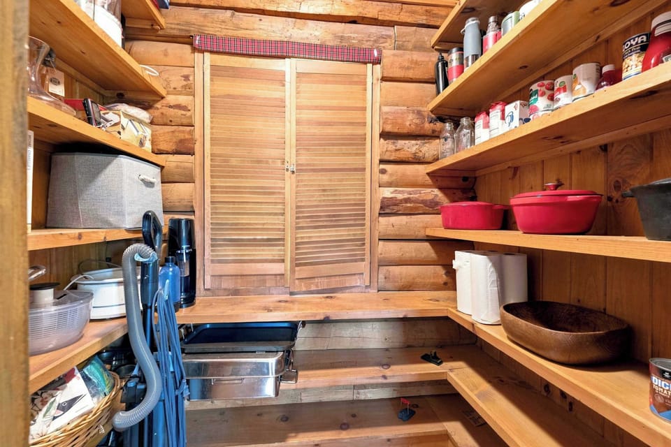 A tucked-away storage nook keeps extra supplies and cleaning gear out of the way.