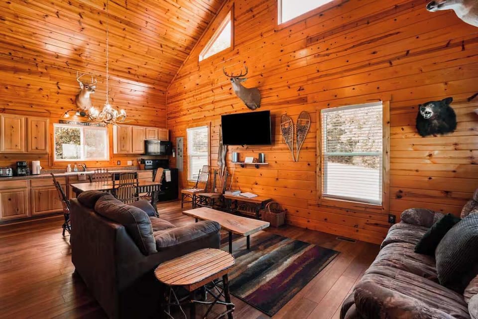 Living Room: Warm wooden accents and inviting seating create a perfect gathering spot!