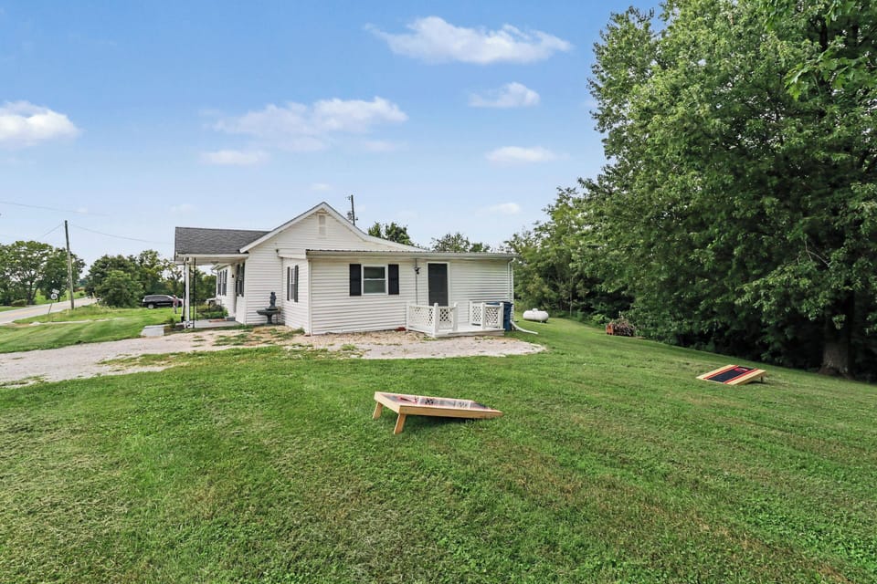 Large yard on approximately 2 acres with corn hole and room for outdoor games 