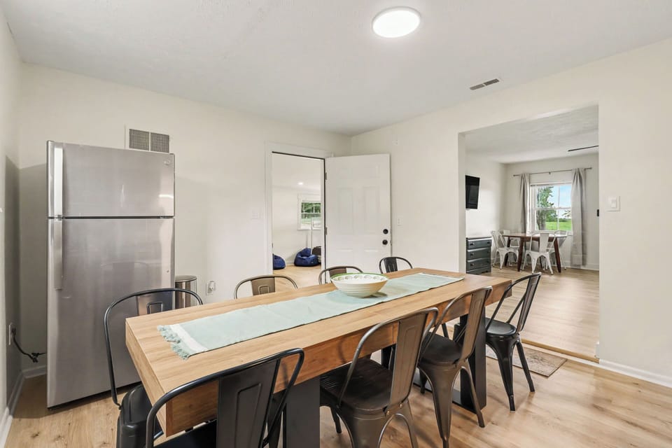 dinning table seats 8 with an open view into the living room 