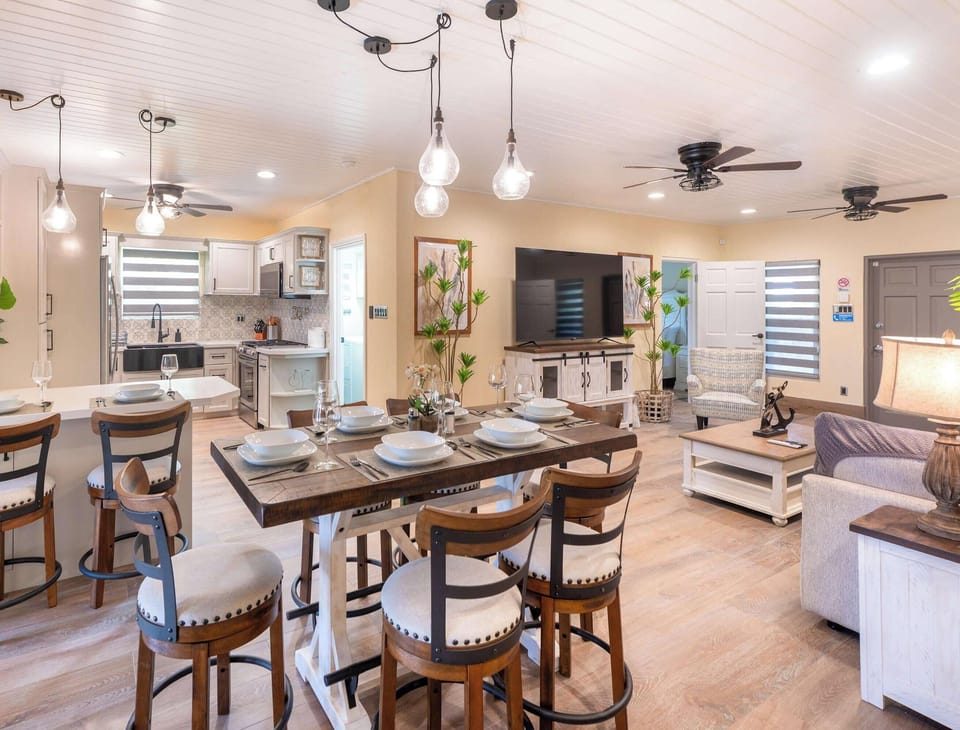 Open-plan dining area flowing into the kitchen and living space