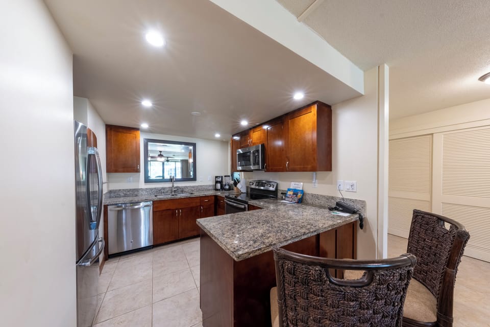 Cook effortlessly in the granite kitchen with modern appliances.