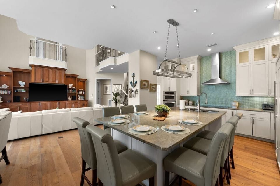 Spacious open-concept kitchen and living area with island seating for 6