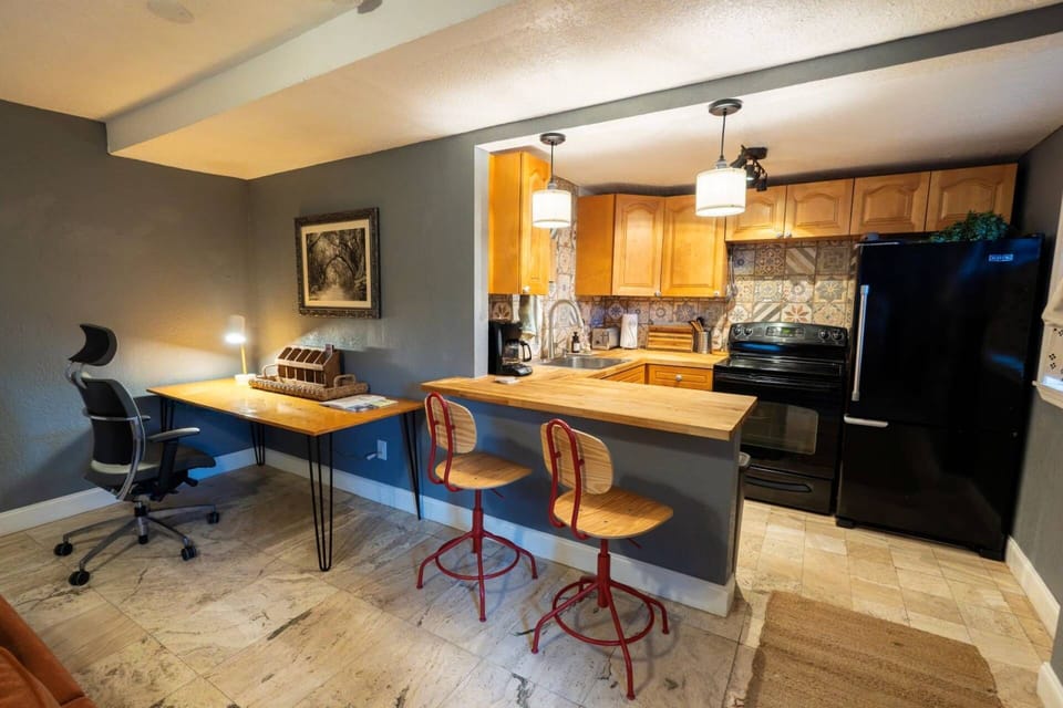 Bar seating for two offers the perfect setting for breakfast, dinner, or morning coffee.