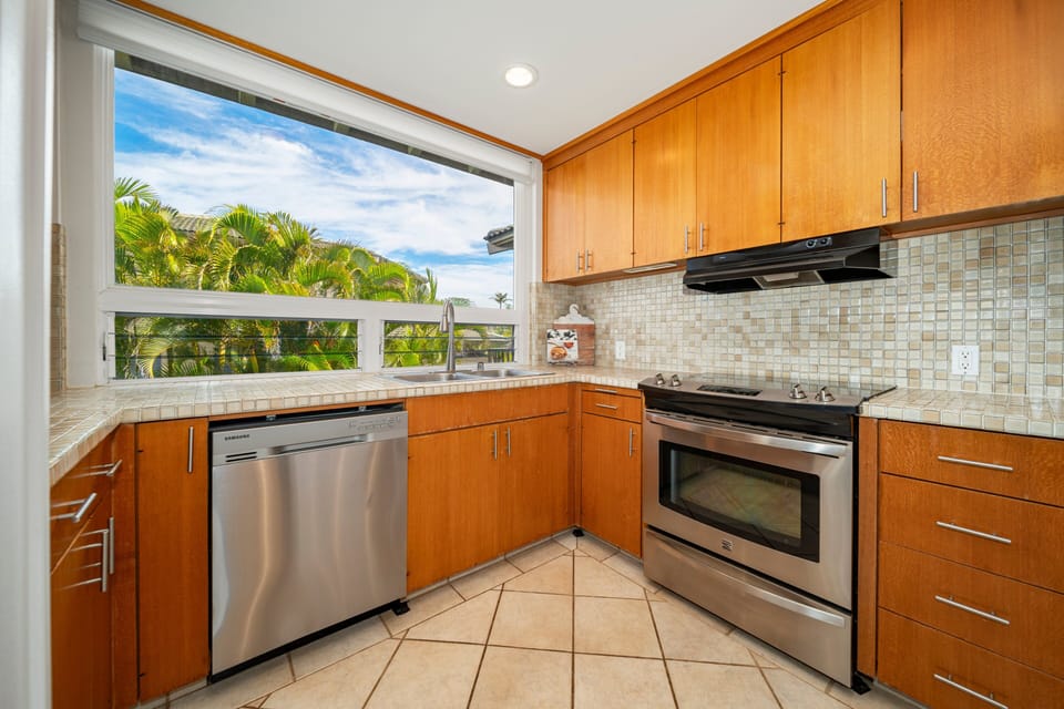 Fully equipped kitchen with stainless steel appliances.